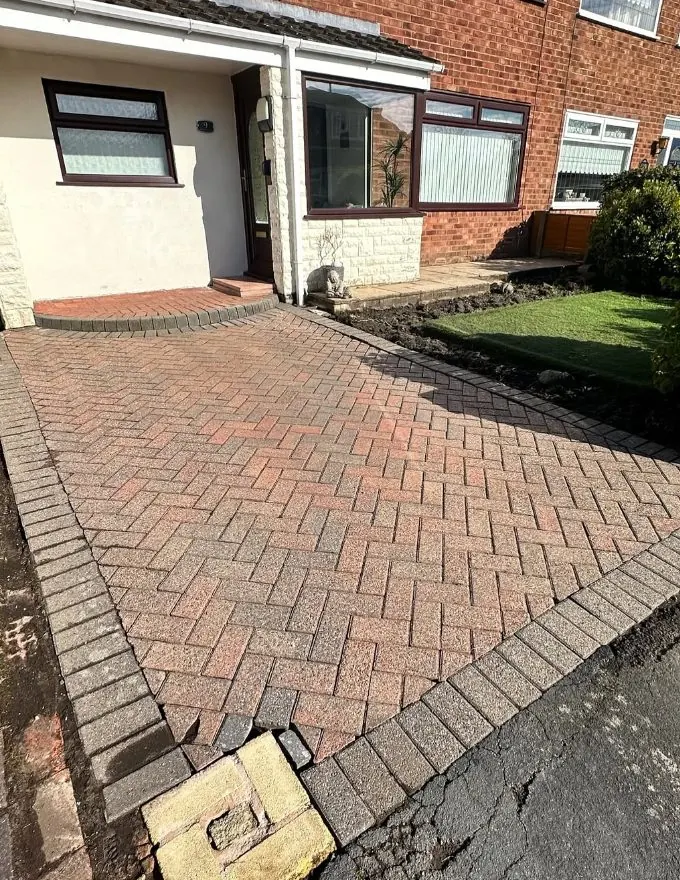 Restored block paving driveway showing vibrant colours after professional cleaning