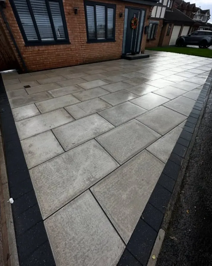 Clean grey patio slabs after professional steam cleaning treatment